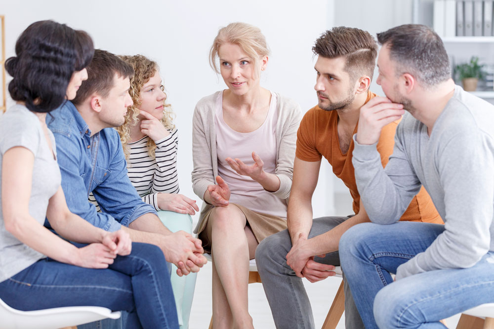 Counselor conducting group therapy